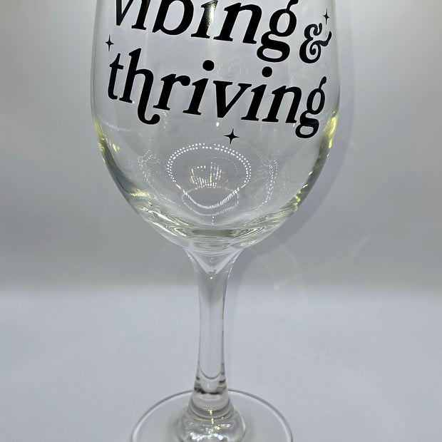 Vibing & Thriving Wine Glass